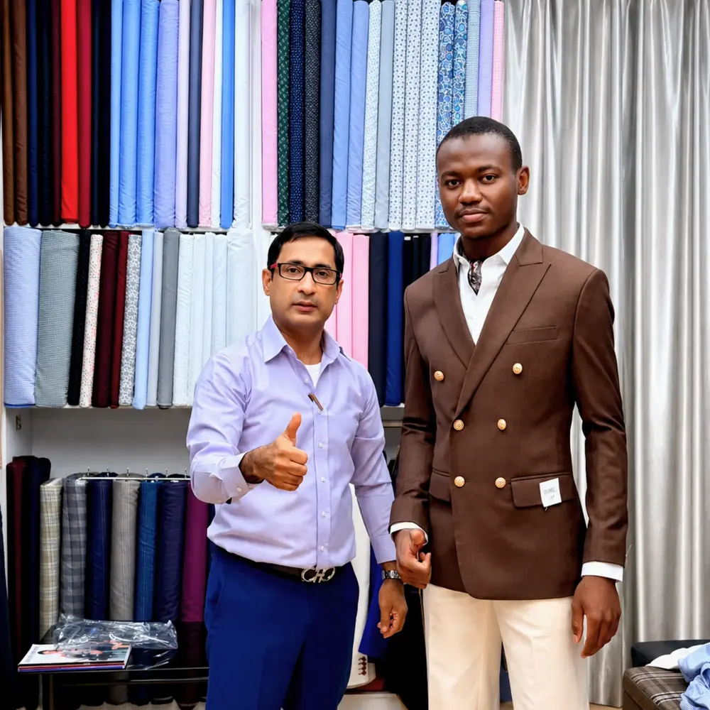 Client in a brown double-breasted blazer with gold buttons and cream trousers beside a tailor