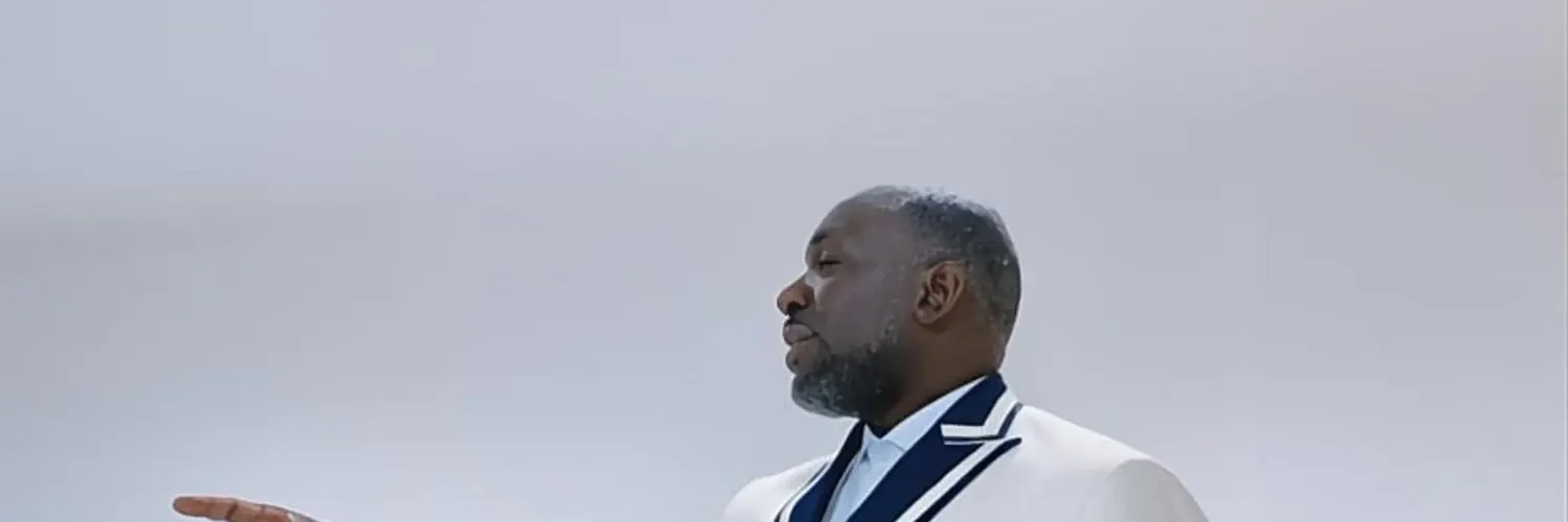 Client in a white double-breasted dinner jacket with navy piping in a bright private room